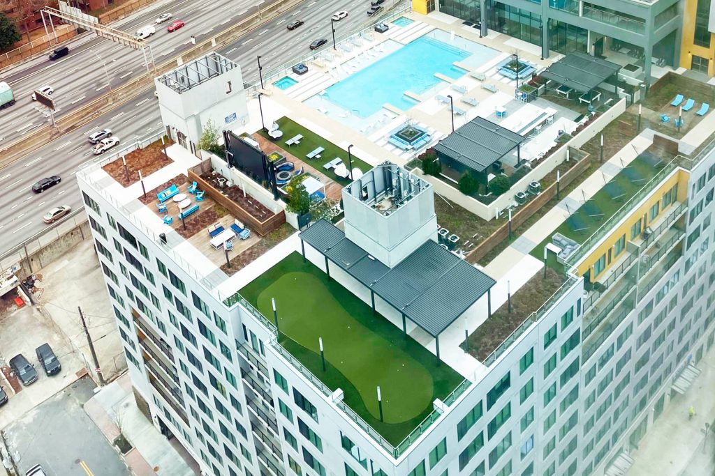 A Hotel Rooftop With Green Space Including Artificial Golf Grass